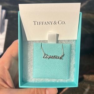 Tiffany&Co “ amour” necklace.